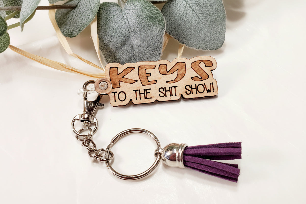 Snarky keychain collection showing different funny sayings, affordable gifts under $10