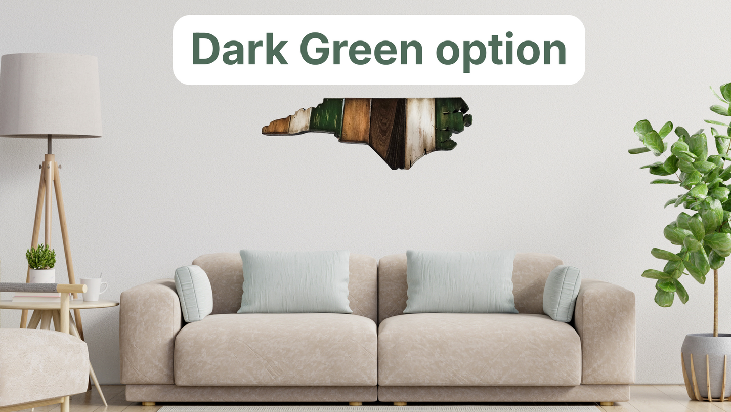 Living room setting featuring a dark green, white, dark stain, and light stain painted , handmade large North Carolina wall art hanging over the couch.