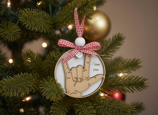 ASL ornament with hand sign and 'I love you' text, tied with a red checkered ribbon, 2025 year charm, and bead
