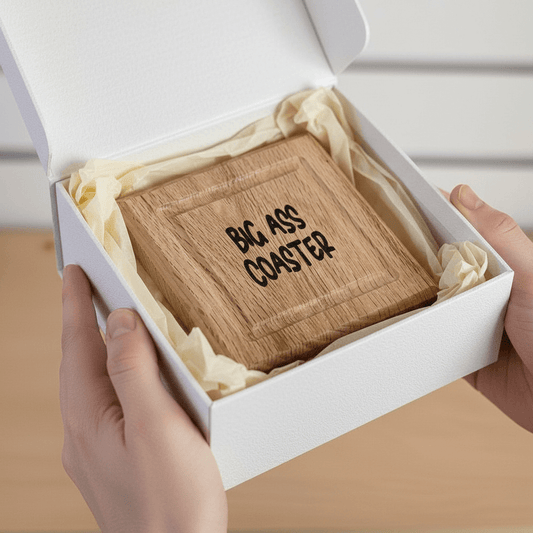 Wooden oak coaster with 'BIG ASS COASTER' text in a white gift box