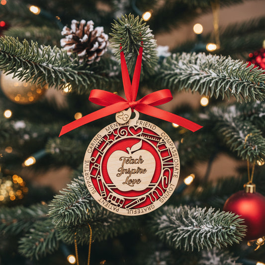 Beautiful teacher appreciation ornament, with red ribbon on a tree