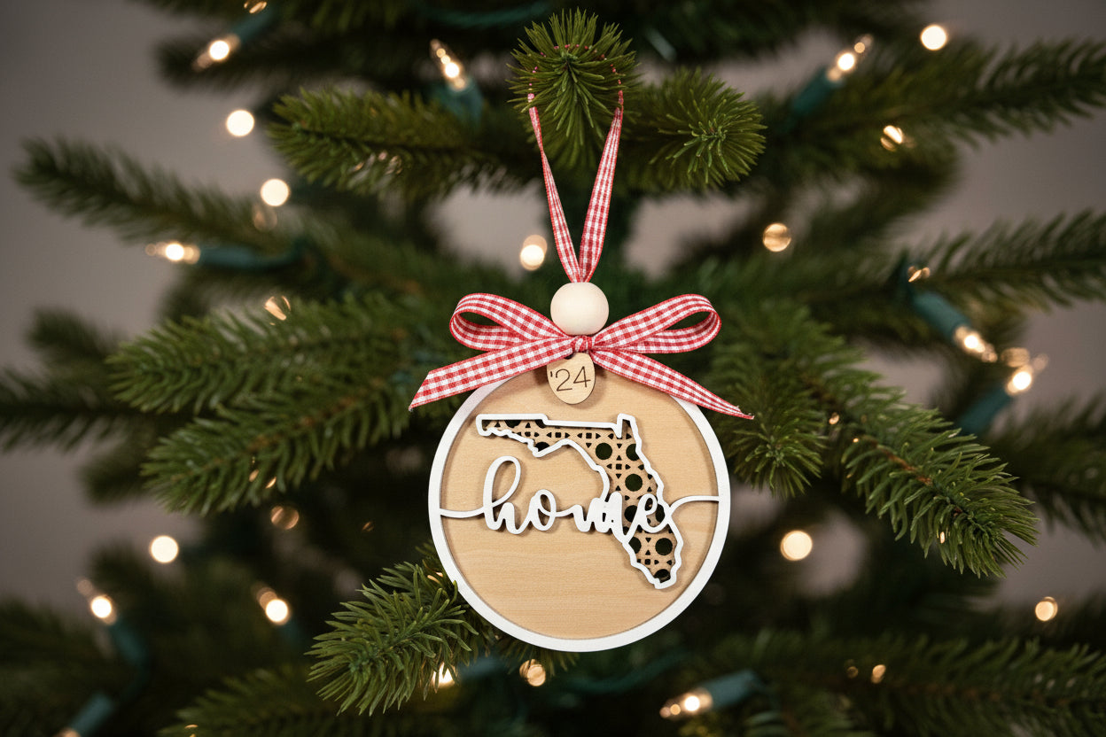 Decorative  Florida Christmas ornament with 'home' text, holiday tree background