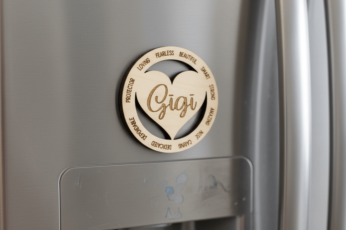 Wooden 'Gigi' heart-shaped magnet on a refrigerator door