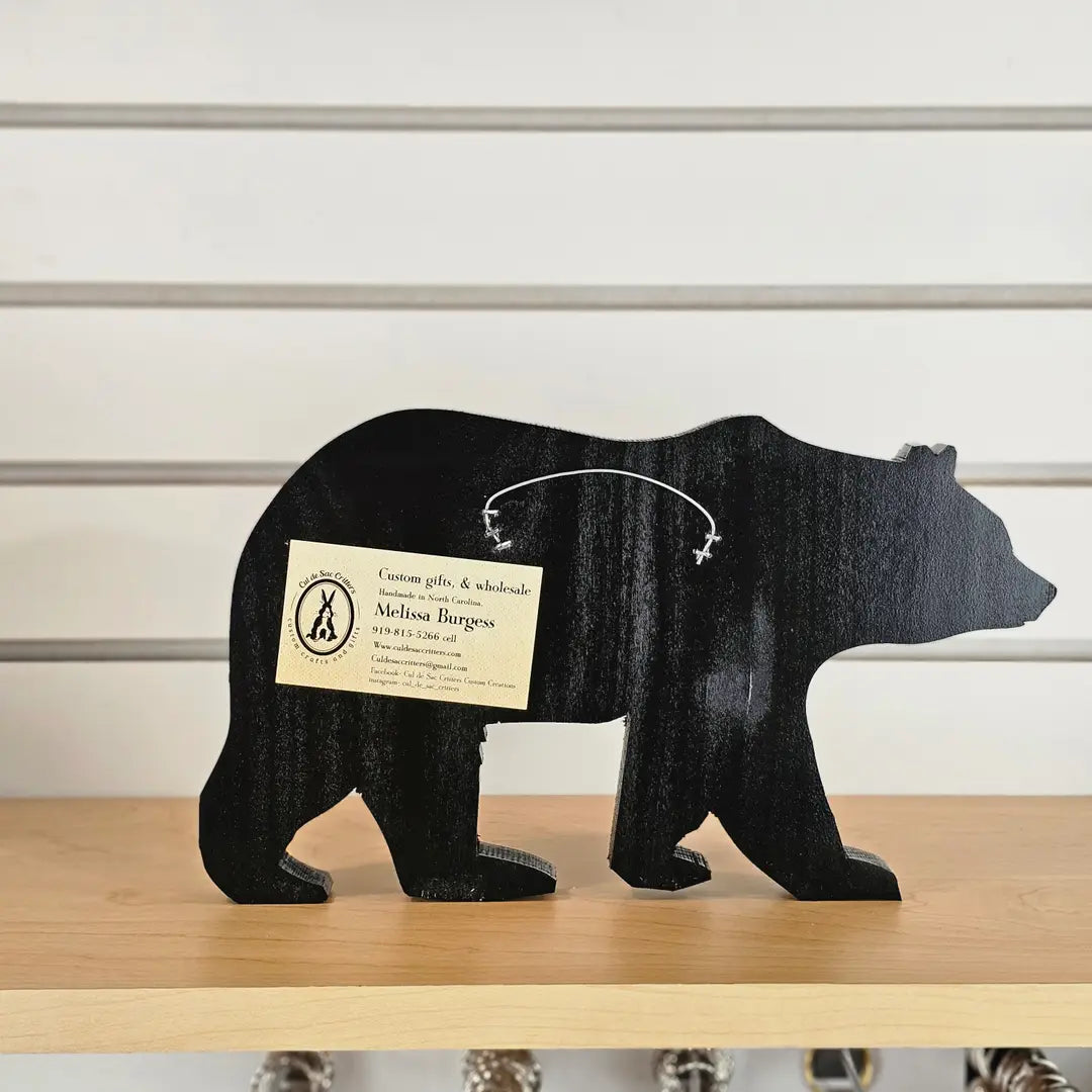 Back view of rustic bear wall art showing handcrafted wood construction and mounting hardware