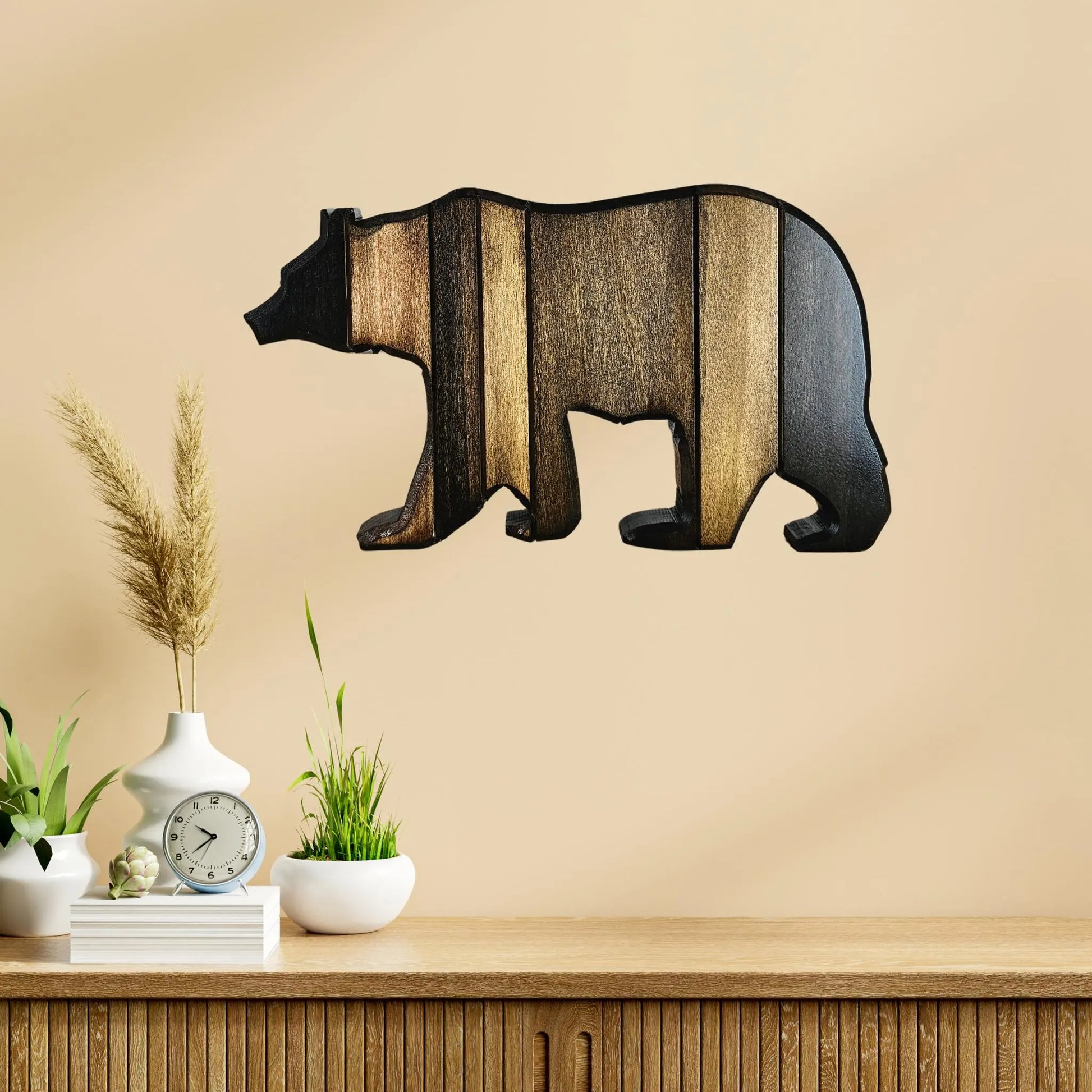 Medium size Wooden bear wall decoration on a beige wall with a wooden shelf below.