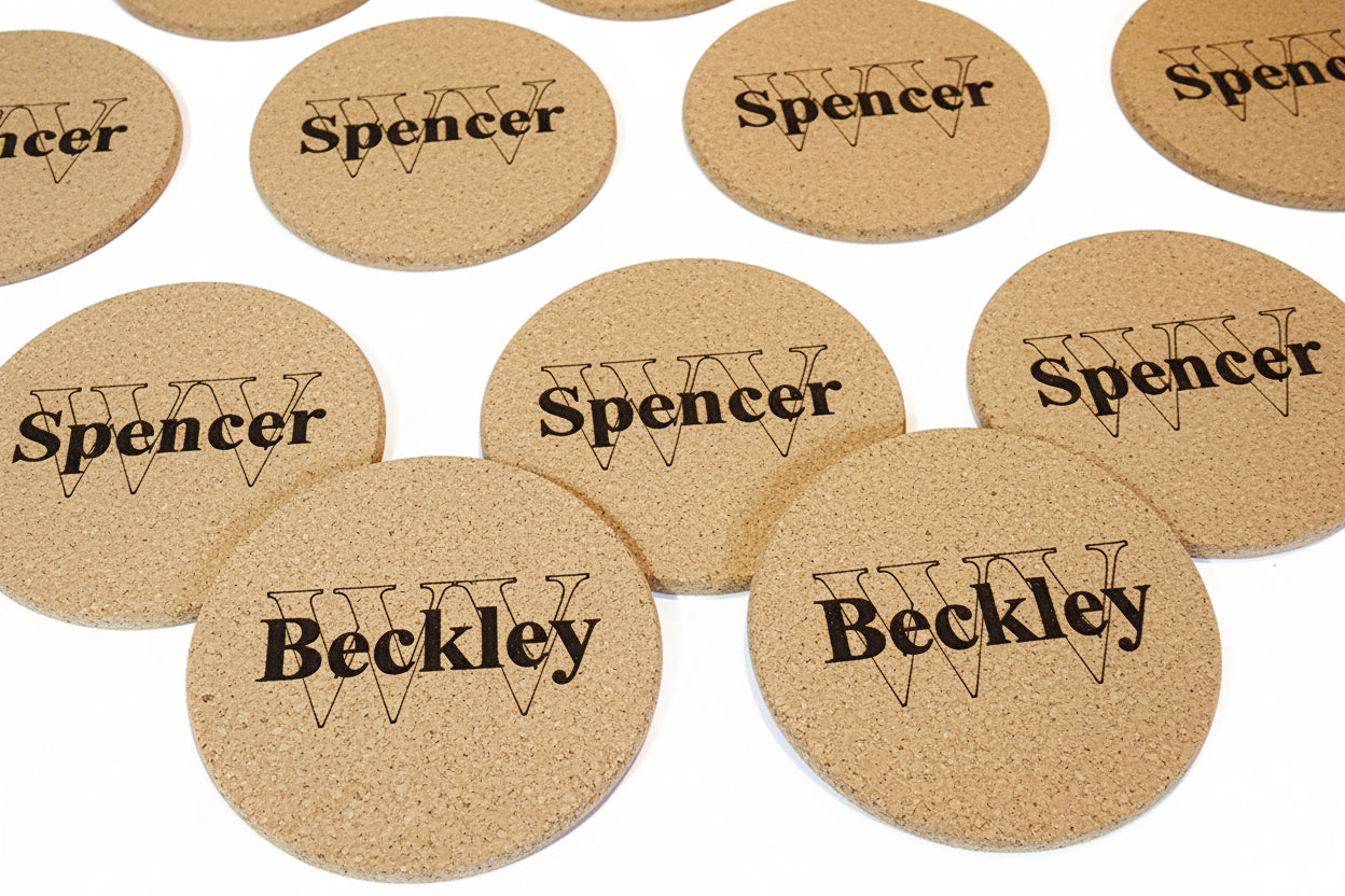 Cork coasters with 'Spencer' and 'Beckley' branding on a white background
