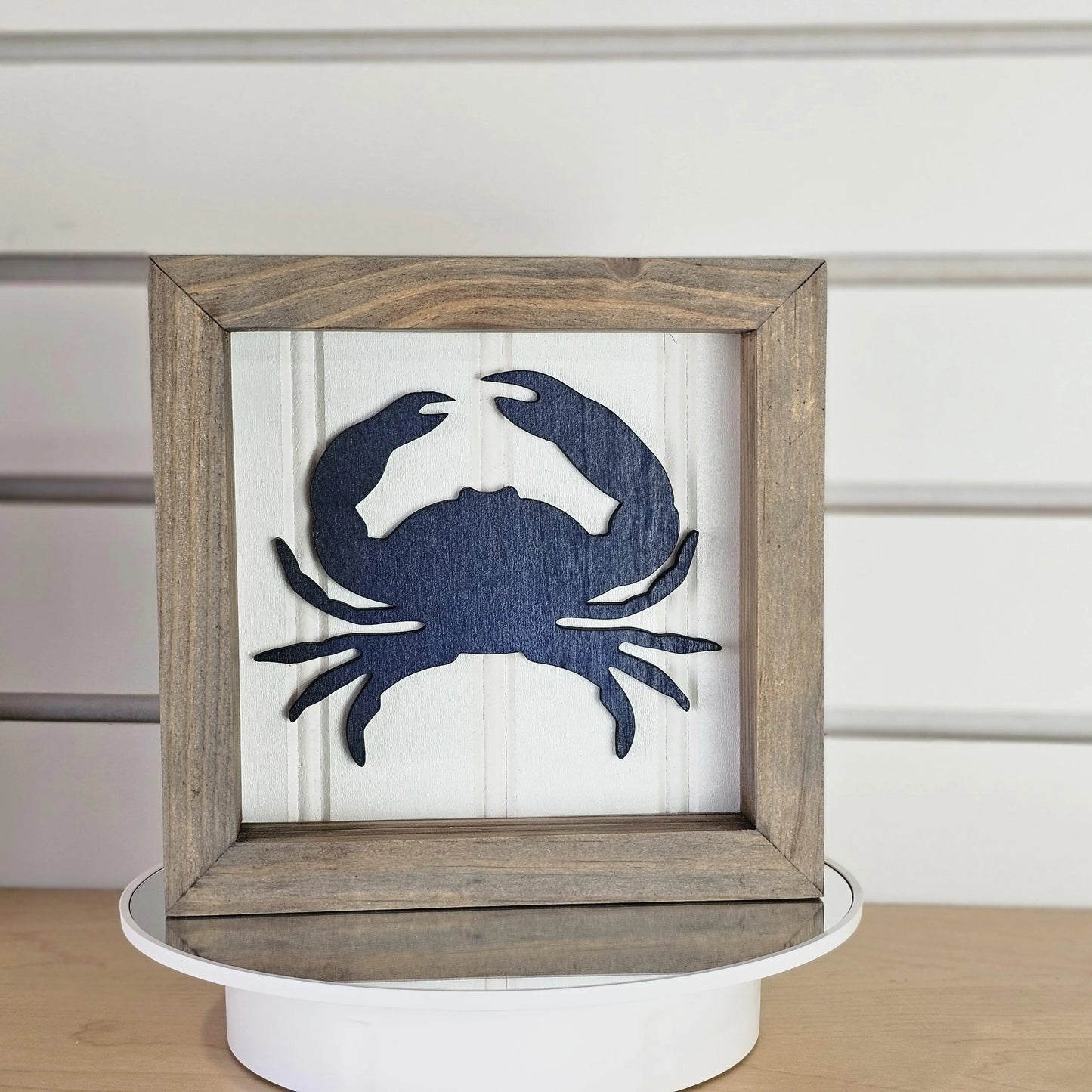 Handmade Framed artwork of a blue crab on a white background