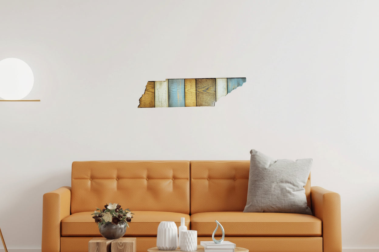 Orange sofa with Tennessee wall art and decorative items in a living room setting