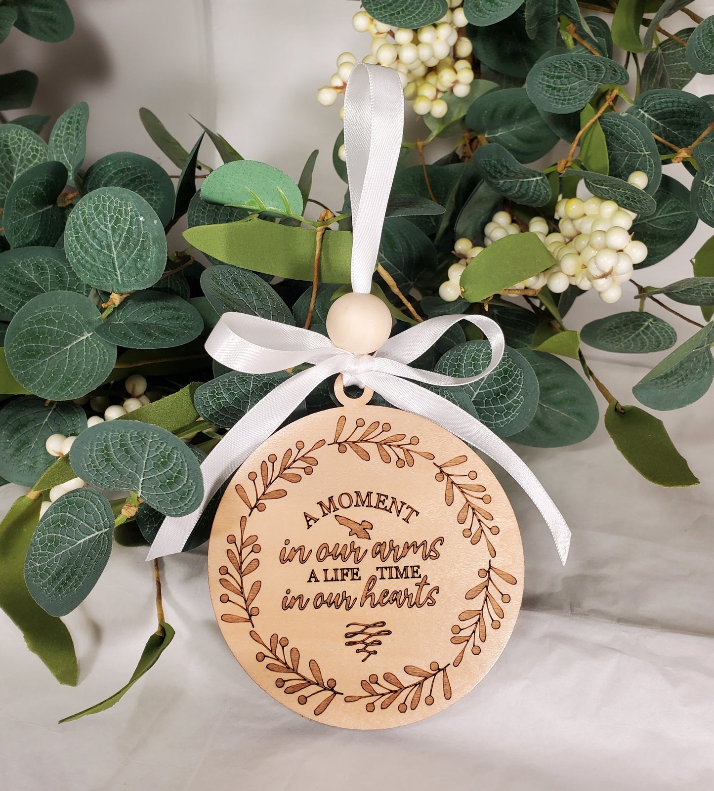 A Moment in Our Arms A Lifetime in Our Hearts - memorial ornament - engraved wood ornament with white satin ribbon