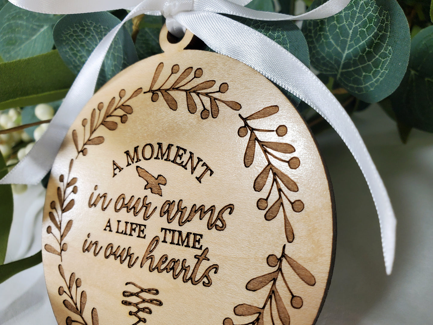 A Moment in Our Arms A Lifetime in Our Hearts - memorial ornament - engraved wood ornament with white satin ribbon