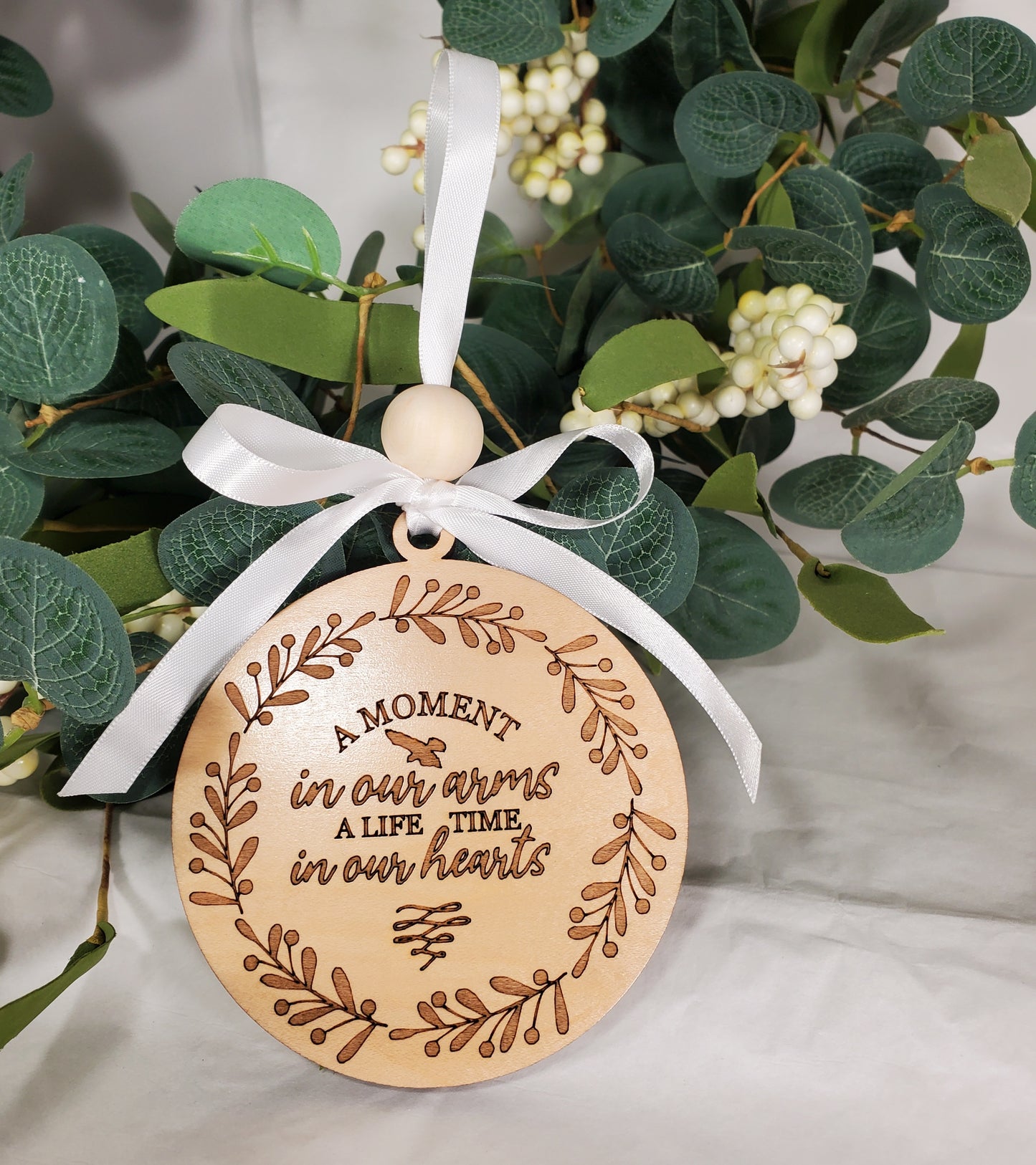 A Moment in Our Arms A Lifetime in Our Hearts - memorial ornament - engraved wood ornament with white satin ribbon