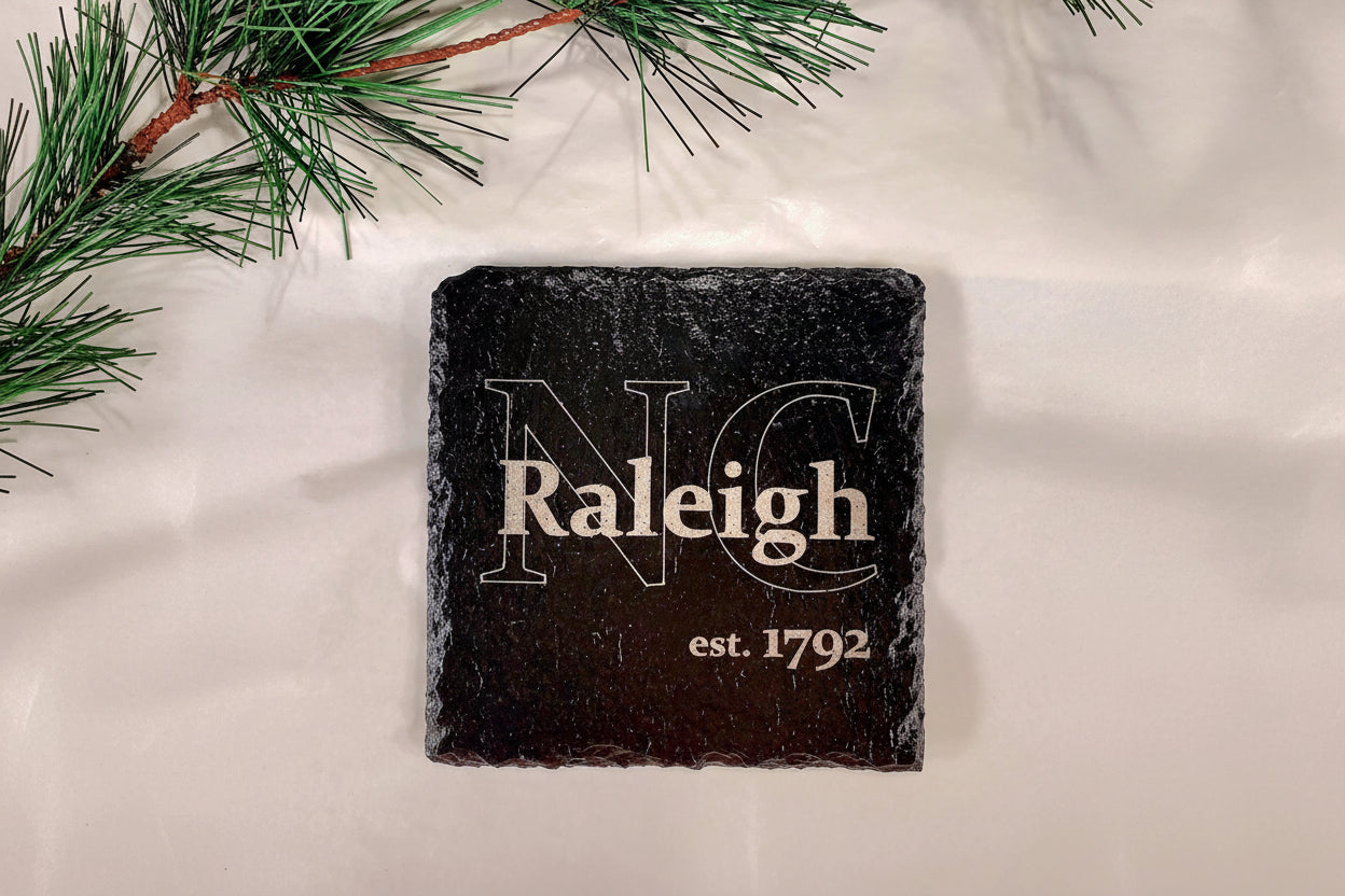 Close-up of engraved NC slate coaster 