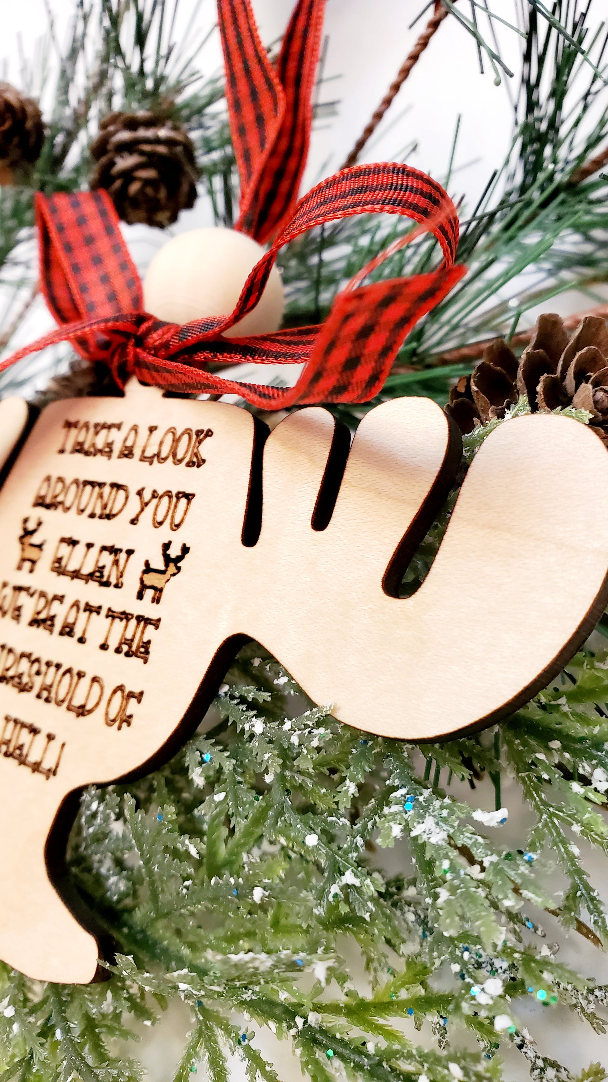 close-up of the natural grain and engraving on the moose cup ornament.