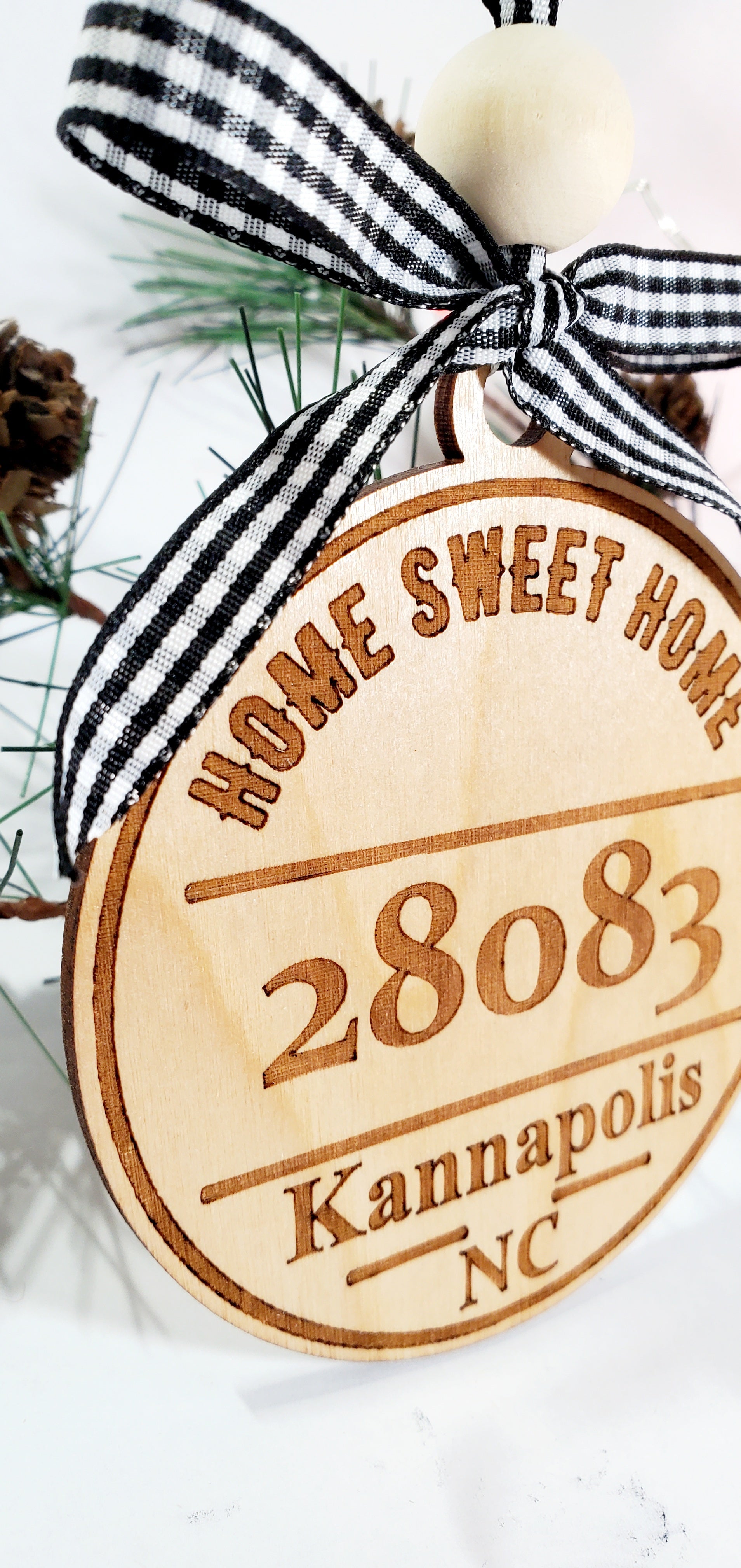 closeup of custom home sweet home ornament to show the grain of the wood.